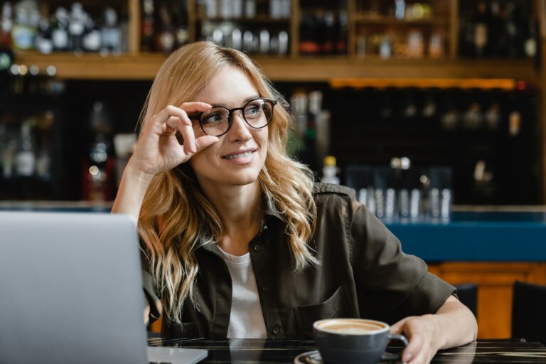 Tutor self-employed working remotely on laptop, e-commerce, work break in cafe